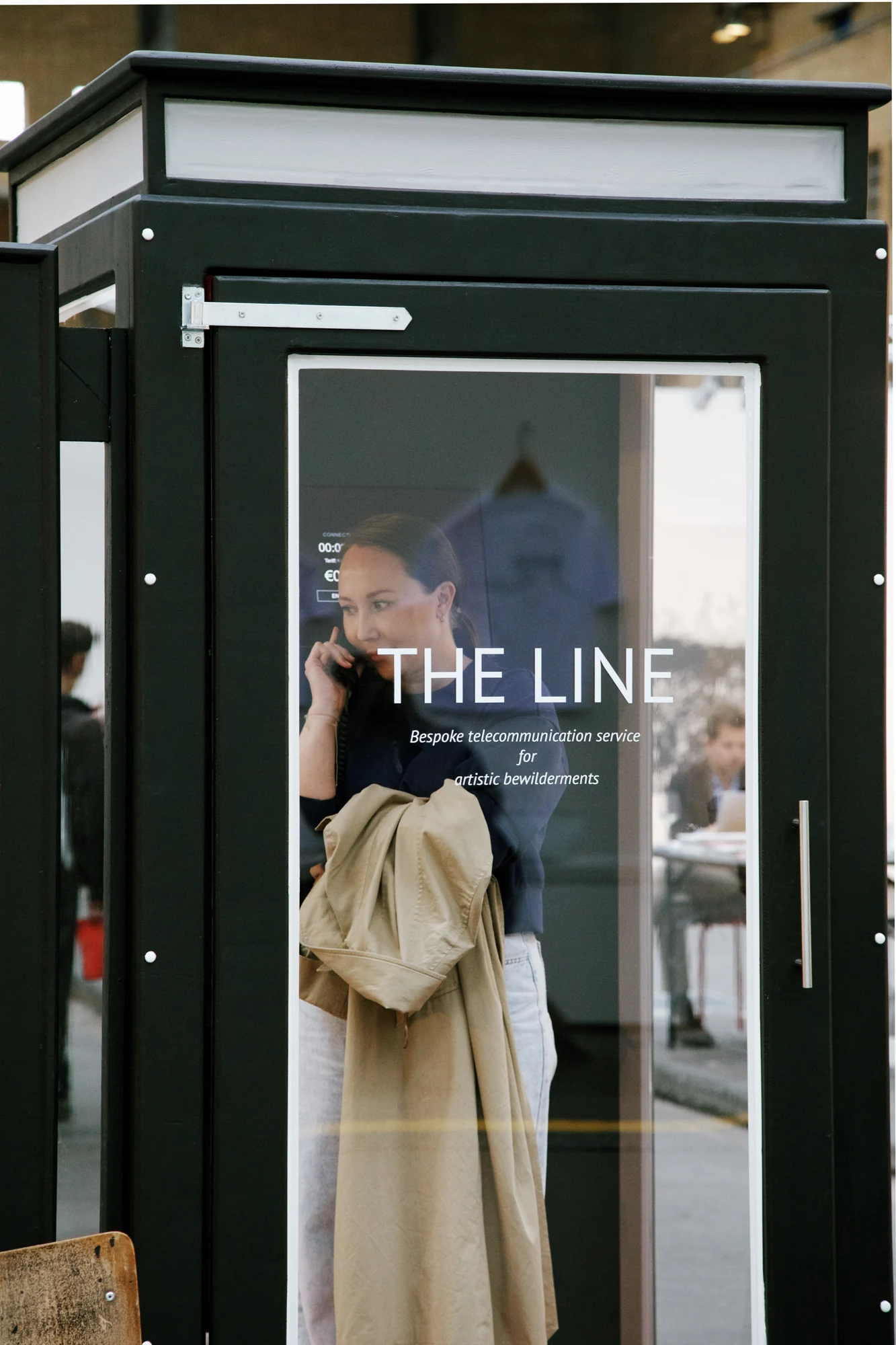 A visitor making a call inside The Line’s booth.